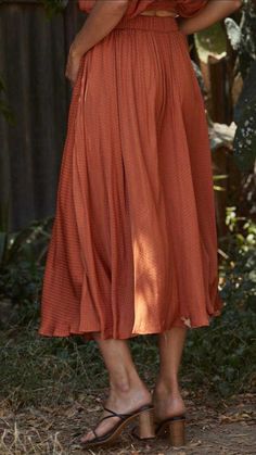 Even though this Woven Satin Long Midi Skirt is a pre-fall piece, it can be worn year round. This beautiful satin silk skirt has that perfect classic fit. Orange-color. Lined. Satin fabric. Side pockets. Full circle skirt. Woven Satin Long Midi Skirt fits true to size. By Together LA. **Skirt for sale only, top not available. Woven Satin Long Midi Skirt Measurements: Small measures 30" overall length. Medium measures 31" overall length. Large measures 32" overall length. 100% Poly, lining 100% R Fall Pleated Skirt With Elastic Waistband, Relaxed Fit, Summer Midi Skirt With Folds, Summer Maxi Skirt With Folds, Spring Silk Pleated Skirt With Lining, Relaxed Pleated Skirt For Fall, Relaxed Fit Pleated Skirt For Fall, Silk Relaxed Tiered Skirt, Relaxed Pleated Skirt With Folds For Fall, Fall Pleated Skirt With Elastic Waistband