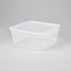 a plastic storage container with lid on a grey background