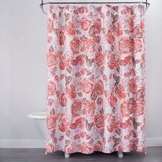 a shower curtain with red flowers on it