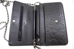 An CHANEL Black Camellia Embossed Wallet On Chain WOC Shoulder Bag k68 This item is Contemporary. The year of manufacture would be 2012.This browser is not supportedConditions & RatingsOutside material: LambskinColor: BlackClosure: SnapHardware and chain: Silver-ToneMade in FranceSerial sticker: AttachedSerial #: 17993335 (Same number on the sticker and the card.)Manufactured in 2013.Comes with: ity card, BoxOverall: 8 of 10 - The outside is in excellent condition with minimal signs of use only. Chanel Wallet On Chain Camellia, Jimmy Choo Sunglasses, Wallet On Chain, Fendi Shoes, Chain Silver, Trending Handbag, Dior Shoes, Chanel Black, Sunglasses Branding