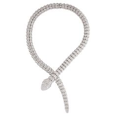 Bulgari Serpenti diamond snake necklace in 18k white gold, accompanied by Bulgari box. This striking Bulgari Serpenti piece features approximately 73.81 carats of round brilliant cut diamonds pave set over the entirety of the necklace, as well as 2 pear shape diamond eyes weighing approximately 1.00 carat. Total, there is approximately 74.81 carats. Numbered and signed BVLGARI. Bvlgari Serpenti Necklace Gold, Snake Necklace Bulgari, Bulgari Jewelry Snake, Snake Diamond Necklace, Bvlgari Serpentine Necklace, Bvlgari Snake Necklace, Bvlgari Necklace Snake, Bvlgari Jewelry Necklaces, Bulgari Jewelry Necklaces