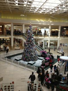 a large christmas tree in the middle of a mall