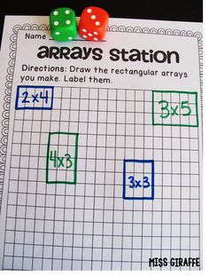 two dices on top of each other next to a graph paper with the word array station