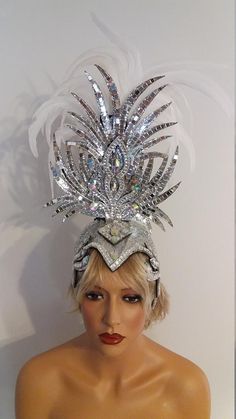 Fitted Costume Hats And Headpieces For Carnival, White Costume Hats And Headpieces For Carnival, Feather Trim Headpieces For Carnival Evenings, Feathered Evening Headpieces For Carnival, Festival Headpiece With Ostrich Feather Trim, Carnival Headband With Feather Trim, Showgirl Feather Headdress, Celebrity Wigs, Feather Headpiece