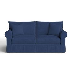 a blue couch sitting on top of a white floor