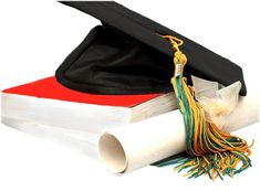 a graduation cap and diploma laying on top of each other