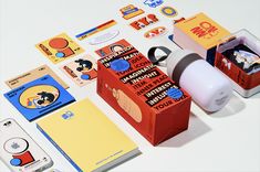 an assortment of stationery items are displayed on a table with paper and stickers