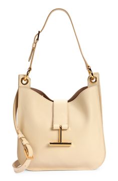 Signature T-shaped hardware brings discreet branding to an iconic Tom Ford top-handle bag crafted of beautifully grained leather. A detachable strap that easily converts for shoulder to crossbody wear offers another carrying option for styling versatility. Magnetic-snap tab closure Adjustable top-carry handle; removable, adjustable shoulder strap Interior zip pocket Lined Leather Made in Italy Designer Handbags Everyday Calf Leather Shoulder Bag With Branded Hardware, Chic Calf Leather Shoulder Bag With Branded Hardware, Modern Rectangular Bucket Bag With Branded Hardware, Modern Bucket Bag With Gold-tone Hardware In Calf Leather, Tan Shoulder Bag With Palladium Hardware For Work, Chic Business Bucket Bag With Gold-tone Hardware, Chic Bucket Bag With Gold-tone Hardware For Business, Chic Calf Leather Shoulder Bag With Metal Hardware, Chic Workwear Bucket Bag With Palladium Hardware