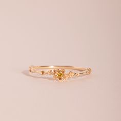 A flurry of sweet little buttercups and yellow sapphires, a little garden in a ring. Good Promise Ring, Yellow Gold Promise Rings, Yellow Ring, Buttercup Ring, Minimalist Accessories Jewellery, Catbird Jewelry, Hand Jewelry Rings, Minimalist Accessories, Gold Rings Simple