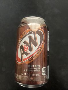 an open can of root beer on a table