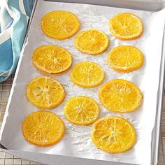 orange slices on a baking sheet ready to go into the oven for making an appetizer