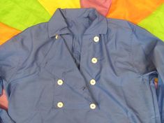 Woman's Monkees style Large 8 button Bib Front Shirt - Red, blue or yellow Fitted Collared Tops With Functional Buttons, Daywear Shirt With Spread Collar And Buttons, Collared Shirt With Covered Buttons For Daywear, Casual Shirt With Spread Collar And Covered Buttons, Casual Collared Blouse With Covered Buttons, Cotton Collared Blouse With Snap Buttons, Collared Shirt With Snap Buttons For Daywear, Blue Top With Button Cuffs And Spread Collar, Collared Cotton Top With Buttons