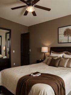 a bedroom with a bed, mirror and ceiling fan