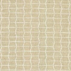 an upholstered beige and white fabric with wavy lines