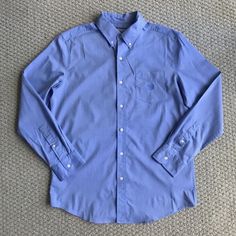 New With Tags. Size Medium. 64% Cotton, 32% Polyester, And 4% Elastane. Also Have This Button Up In A Teal Green Color In My Listings. Measurements Are 31" From Top Of Shoulder To Hem, Sleeves Are 25 1/2" Long, And Body Is 22 1/2" Wide Across Laying Flat. Classic Light Blue Shirt With Pockets, Blue Business Shirt With Pockets, Business Blue Shirt With Pockets, Classic Blue Tops With Pockets, Blue Cotton Dress Shirt With Pockets, Classic Blue Shirt With Pockets, Casual Blue Button-up Dress Shirt, Formal Blue Tops With Pockets, Blue Tops With Pockets For Business