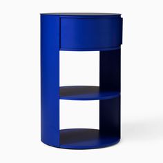 a round blue shelf with two shelves on each side and an open door at the top