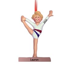 a personalized christmas ornament with a girl doing a handstand on it