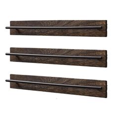 three wooden shelves with metal bars on them