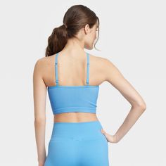 The Pullover Halter Brami from Colsie™ makes for a stylish addition to your casual-cool wardrobe. The pullover brami is constructed from soft, stretchy fabric for comfortable wear, while the no-cup design creates a silhouette you'll feel great about. You'll love the sporty halter neckline and the open back that lends a comfy fit. Simply sport the brami on its own with shorts or layer it beneath a button-down shirt paired with leggings. Colsie™: All You, Inside and Out. Fitted Blue Activewear With Built-in Bra, Blue Summer Activewear With Built-in Bra, Compressive Blue Activewear With Built-in Bra, Blue Sports Bra With Built-in Bra And Micro-elastic Fit, Blue Compressive Seamless Sports Bra, Women Halter, Halter Neckline, Cup Design, Comfy Fits