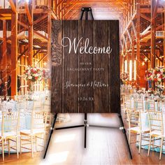 a wooden sign sitting in the middle of a room filled with tables and chairs