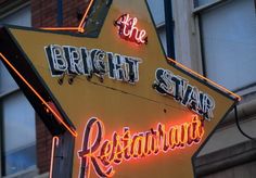 the bright star restaurant sign is lit up