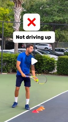 a man standing on top of a tennis court holding a racquet