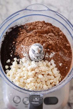 a food processor filled with ingredients for making macaroni and cheese