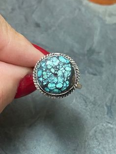 Simple and stunning, this sweet little ring boasts a 1/2" round, webbed, Cloud Mountain Turquoise stone. The veining in the stone is so cool! The stone is set in Sterling Silver with braid detail around the edge. Straight shank, minimalist band makes this ring so easy to wear. Size 8 1/2 US. Signed LQ on bottom of ring and 925 on inside of band. Weighs .2 oz. There is tarnish on the bottom of the ring and a little round circle in the middle of the stone - not sure what that is about but it came to me that way. Cloud Mountain Turquoise comes from a mine in the Hubei Province of Central China. Very distinct and unique stone. Beautiful gift! Cloud Mountain, Native American Rings, Round Circle, Southwestern Style, Turquoise Jewelry, Turquoise Stone, Sterling Silver Ring, That Way, Favorite Jewelry