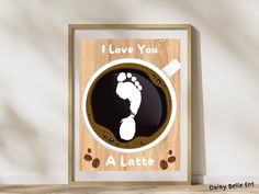 i love you a latte with the image of a baby's foot in a cappuccino