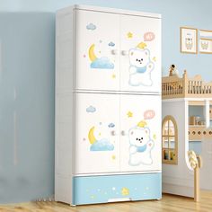 a white refrigerator freezer sitting in a child's room