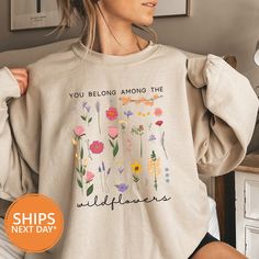 Here at Lavender Lane we offer the best WILDFLOWERS hoodies made from the softest material! It will quickly become your favorite sweatshirt! All of our FLORAL crewnecks are handmade to order with eco-friendly ink because we want our customers to feel good about the sweater they are purchasing! The details: *Printed using an eco- friendly water based ink. *FREE shipping on all orders. *All orders ship the same or next business day regardless of how large the order is! *Unisex sizing. *Order your Flower Sweater, Gifts Mom, Friend Gifts, Mom Gifts, White Ink, The Flowers, Best Friend Gifts, White Shirt, Best Friend