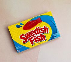 a box of swedish fish candy sitting on top of a table