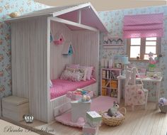 a doll house with a bed, desk and chair in the room next to it