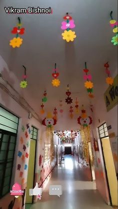 the hallway is decorated with colorful paper flowers