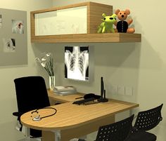 a computer desk with two chairs and a teddy bear on the top shelf above it