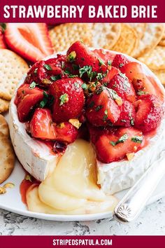 strawberry baked brie on a plate with crackers