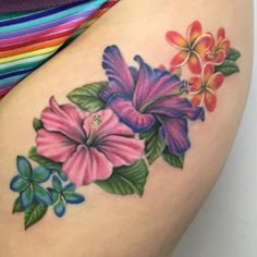 a woman's thigh with flowers painted on it