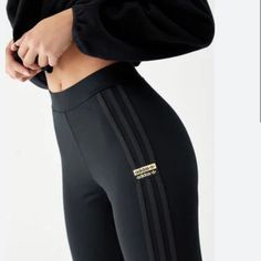 * Brand: Adidas * Size: X-Small * Color: Black * Mid-Rise * 3 Stripe Design * Elastic Waistline * Form Fitting * New W/Tags Make Working Out Feel Good And Look Good With The New R.Y.V Leggings From Adidas. This Pair Features A Mid-Rise Elastic Waistline, A Tight Fit With Stretch, And A Traditional Adidas 3-Stripe Design At The Sides. Adidas Trendy Stretch Bottoms, Trendy Stretch Adidas Bottoms, Trendy Adidas Bottoms, Adidas Fitted Pants For Streetwear, Adidas Fitted Bottoms For Streetwear, Fitted Adidas Pants With Three Stripes Branding, Fitted Black Adidas Pants, Adidas Stretch Black Leggings, Adidas Black Stretch Leggings