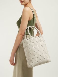 BOTTEGA VENETA   Daniel Lee Maxi Cabat 30 Leather Tote Bag in Mist (Ivory Beige-White) Small tote in the iconic double-face weave  Woven with wide, double-face soft nappa strips   Interior is identical to the exterior; fitted with a ring to attach a pouch or key holder   Smooth rolled nappa handles; slim, detachable crossbody strap  Gold finish hardware Made in Italy Height: 49 cm | 19.2"   Width: 38 cm | 14.9"   Depth: 13 cm | 5.1"  570800VMAH12030 Leather Roll, Small Tote, Key Holder, Leather Tote Bag, Friends In Love, Bottega Veneta, Leather Tote, Mist, Top Handle Bag