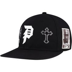 Represent one of hip-hop's most influential figures with this Tupac Shakur Royalty Snapback Hat. It features raised embroidery on the front crown and a wordmark logo on the back, making it instantly recognizable to fans of the hip-hop legend. This snapback also has a structured fit and a flat bill for a classic look. Black Hat With Logo Print And Flat Brim, Black Snapback Hat With Flat Crown For Streetwear, Streetwear Fitted Hat With Logo Patch For Baseball Season, Hip Hop Baseball Cap With Letter Print, Hip Hop Style Baseball Cap With Letter Print, Hip Hop Snapback Baseball Cap For Streetwear, Hip Hop Snapback Baseball Cap, Embroidered Logo Fitted Hat For Streetwear, Hip Hop Cotton Snapback Fitted Hat