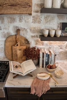 an open book sitting on top of a kitchen counter