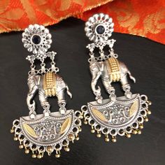 Dual Tone Elephant Earrings/ Two Tone Amrapali Oxidized Chandbali Earrings/ Elephant Earrings/ Indian Traditional Tribal Chandbali Earrings Description: Dimensions: Approx. 3.15 Inches - Comes with Push back Closure - Lightweight Earrings - Contemporary earrings with simulated stones in two tone finish. - Very Elegant and stylish, these earrings can be paired with any traditional Indian or Western Attire depending upon the occasion and the theme. - The base is pure brass (90%) and pure 92.5 silv Fusion Style Latkan Earrings For Rituals, Traditional Dual-tone Earrings For Festivals, Multicolor Latkans Earrings For Rituals, Dual-tone Earrings For Celebrations And Festivals, Dual-tone Earrings For Navratri Celebration, Traditional Multicolor Dual-tone Earrings, Silver Dual-tone Earrings For Festivals, Dual-tone Metal Earrings For Festivals, Dual-tone Drop Earrings For Festivals