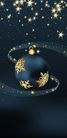 a blue christmas ornament with gold snowflakes and stars in the background