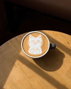 a cappuccino with a cat drawn on it