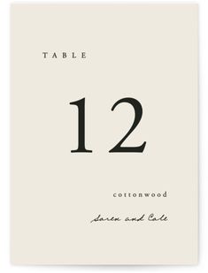 a table number card with the numbers twelve and twelve in black ink on white paper