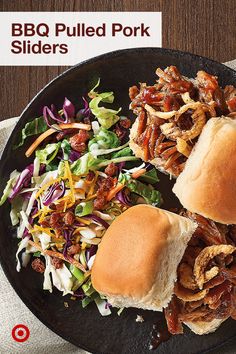 bbq pulled pork sliders with coleslaw and slaw on a black plate