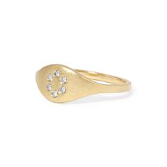 The true beauty of this ring lies in its discreet yet elegant circle of diamonds. Subtly nestled within the design, these diamonds add a touch of understated glamour, elevating your look without overwhelming it. Details: White diamonds .09tcw 14k gold Ready to ship - size 7 All other sizes are made-to-order and can take up to three weeks to ship Diamond Accented Open Signet Ring For Promise, Open Signet Ring With Diamond Accents For Promise, Signet Ring With Diamond Accents For Promise, Diamond Stackable Rings With Pave Setting, Oval Stackable Rings With Diamond Accents For Promise, Classic White Gold Diamond Initial Ring, Classic White Gold Initial Diamond Ring, Fine Jewelry Diamond Signet Ring With Open Design, White Gold Diamond Signet Ring For Promise