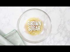 brown sugar in a glass bowl on top of a marble countertop with the words brown sugar