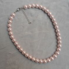 The necklace lengh is 16 inches ,I make the necklace to use 10mm light pink glass pearls,IT has a 2 inches long adjustable chain , IT is good necklace for your great wedding, The picture color is light pink. Can choose other colors are:ivory,white,light pink,Black, red, teal, gray, dark gray, turquoise,green and navy blue. 6-8.5 inches can be used as a bracelet. 12-28 inches can be used for necklaces. Welcome back to my shop: https://www.etsy.com/shop/pearlandjewelry If you need the other lengh Pink Pearl Charm Necklace For Formal Occasions, Pink Pearl Drop Necklace For Formal Occasions, Formal Pink Pearl Necklace With Pearl Charm, Formal Pink Pearl Charm Necklace, Formal Pink Pearl Drop Necklace, Pink Pearl Charm Necklace For Wedding, Classic Pink Pearl Drop Necklace, Wedding Pink Pearl Charm Necklace, Elegant Pink Pearl Beaded Necklace