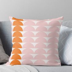 an orange and pink geometric pattern on a white background throw pillow with the same color scheme